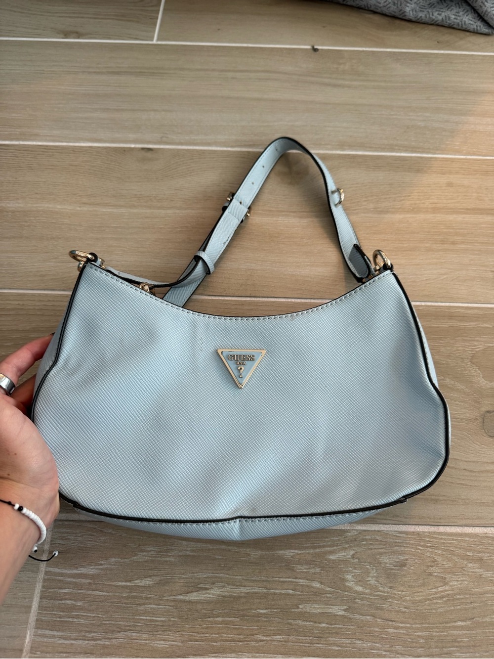 GUESS Pale Blue Curved Shoulder Bag with Gold Accents